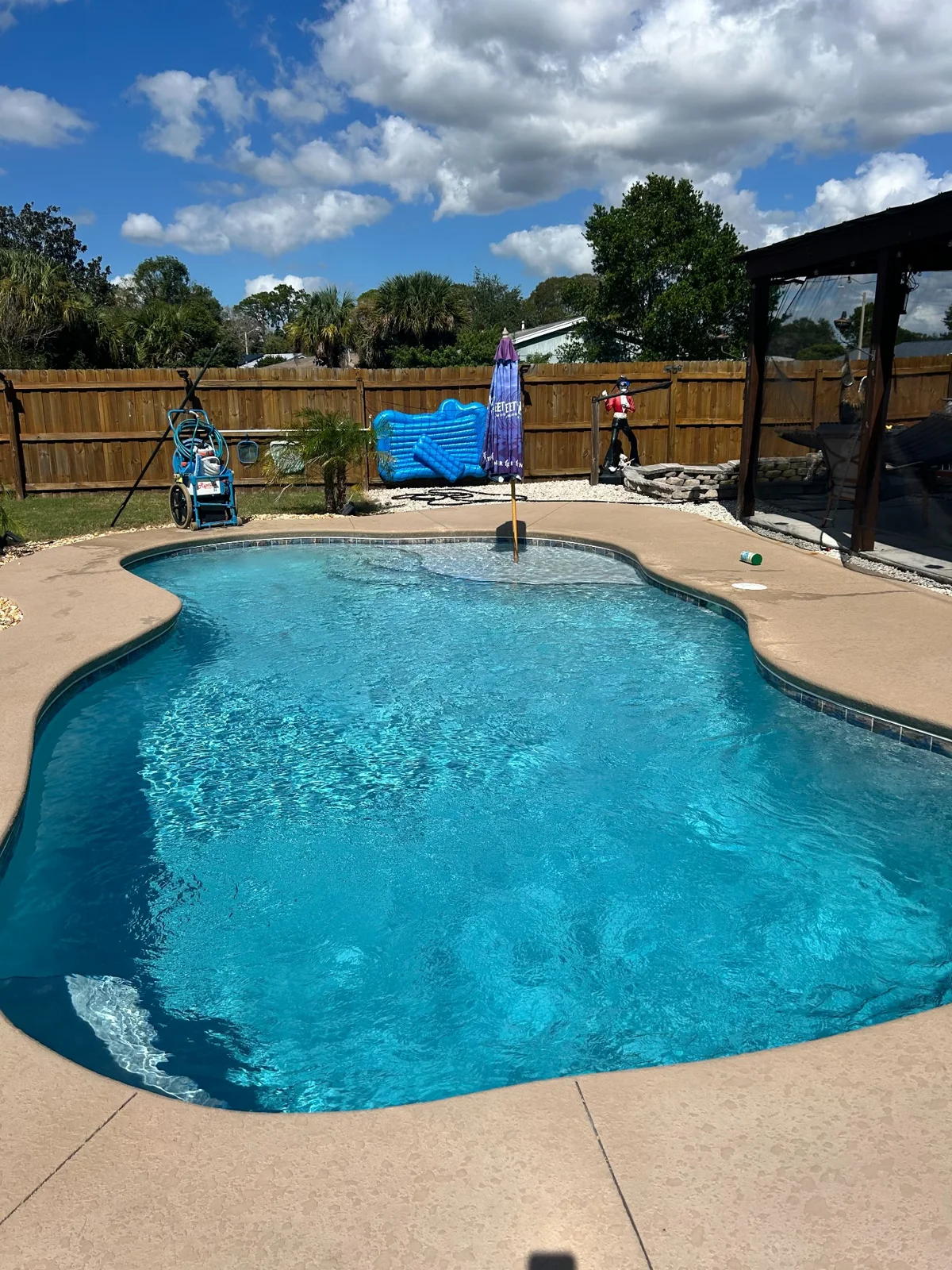 Backyard pool with rounded steps